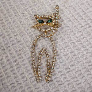 Vintage unsigned rhinestone gold tone cat brooch,moveable body